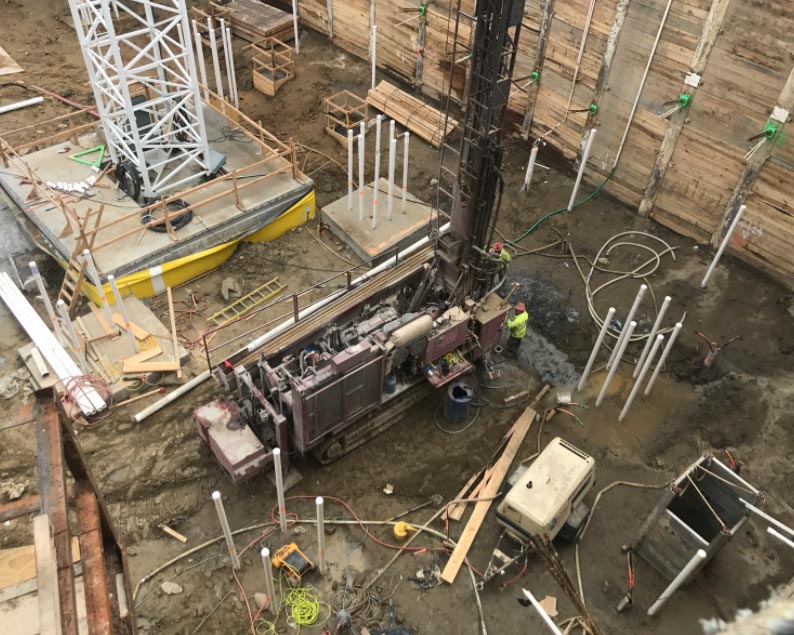 Geothermal drill rig operating inside the Wheaton Town Center construction excavation.