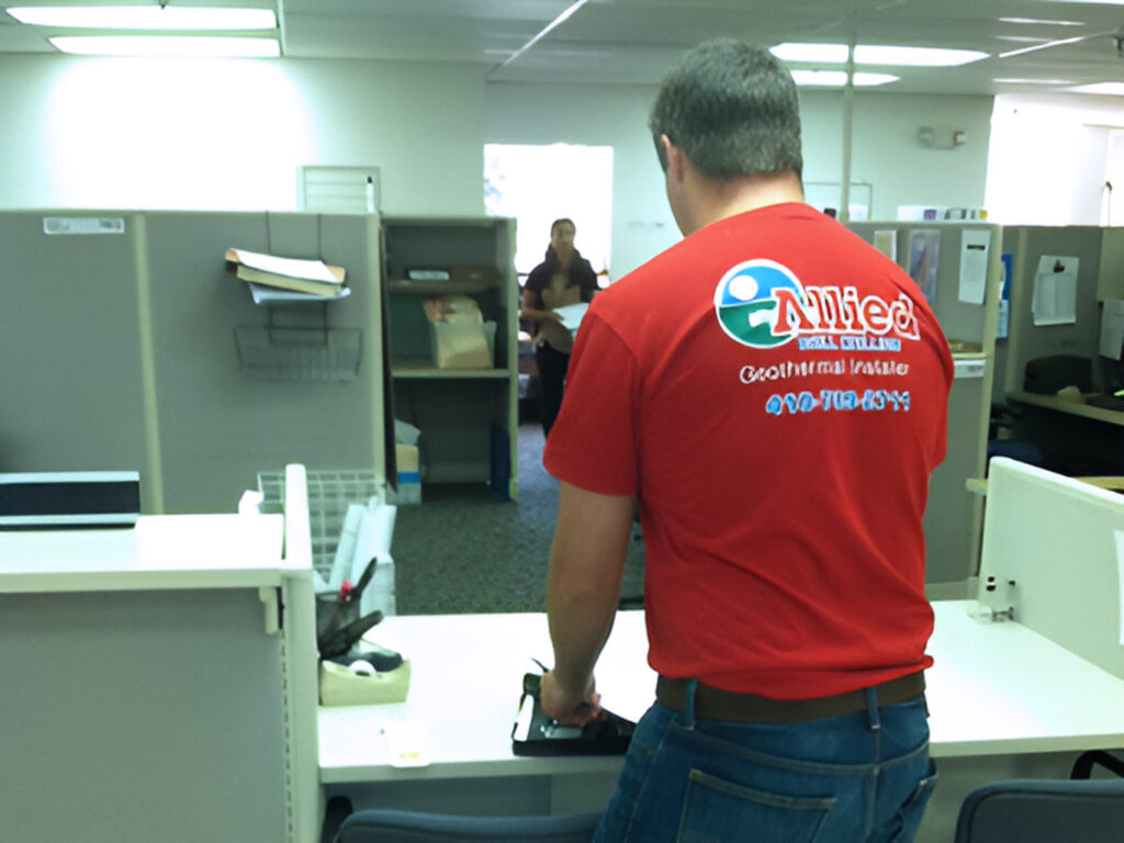 Allied Geothermal team coordinating an indoor site visit as part of the geothermal installation process.